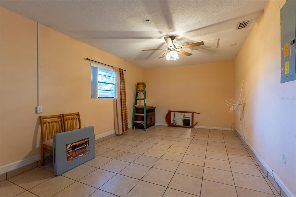 9349 Edison Road Lithia, FL 33547 - Photo 15 of 27 a view of an empty room with a window
