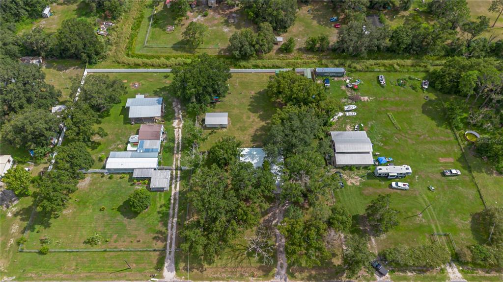 9349 Edison Road Lithia, FL 33547 - Photo 25 of 27 an aerial view of residential house with outdoor space and trees all around