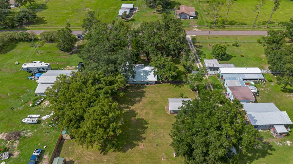 9349 Edison Road Lithia, FL 33547 - Photo 26 of 27 an aerial view of a house with swimming pool outdoor seating and yard
