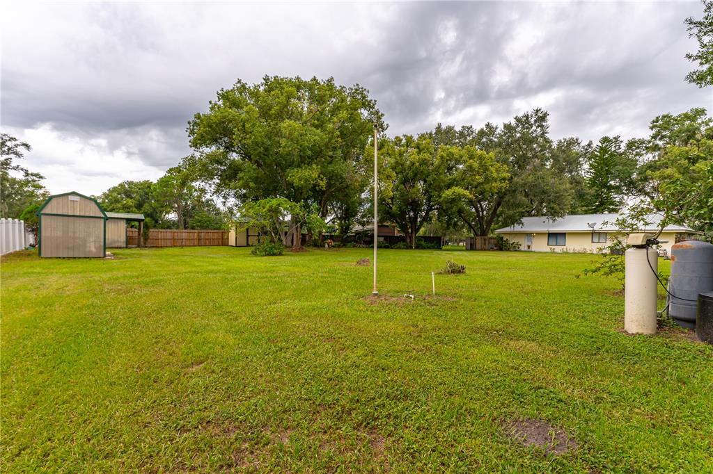 9349 Edison Road Lithia, FL 33547 - Photo 5 of 27 a view of a swimming pool with a yard