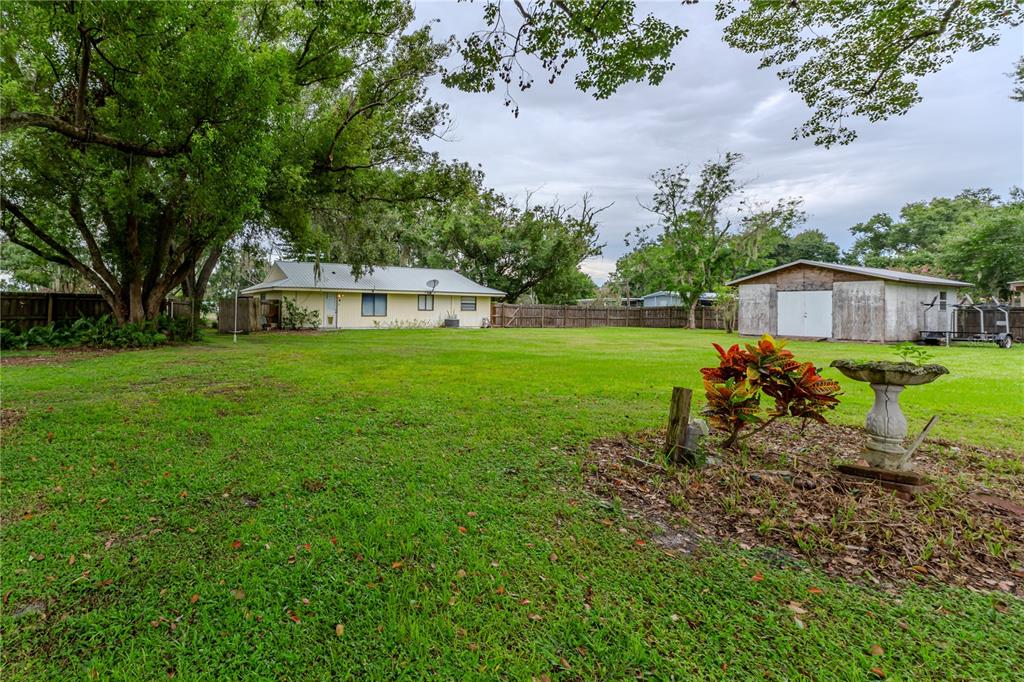 9349 Edison Road Lithia, FL 33547 - Photo 7 of 27 a view of a house with a yard