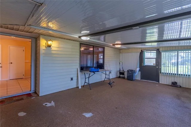 a view of a livingroom with furniture and window