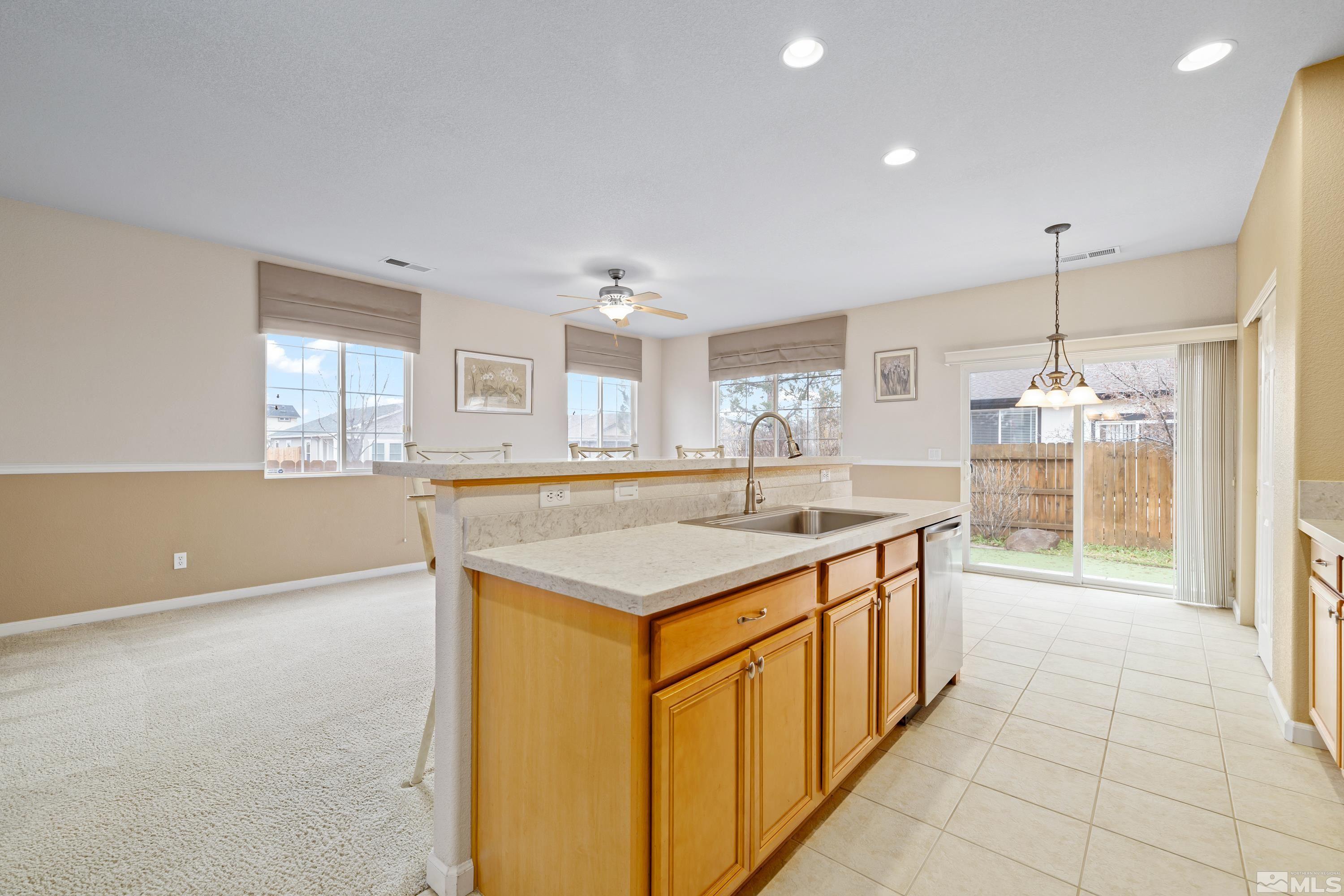 8900 Sorcha Street Reno, NV 89506 - Photo 11 of 39 a kitchen with a stove and a refrigerator