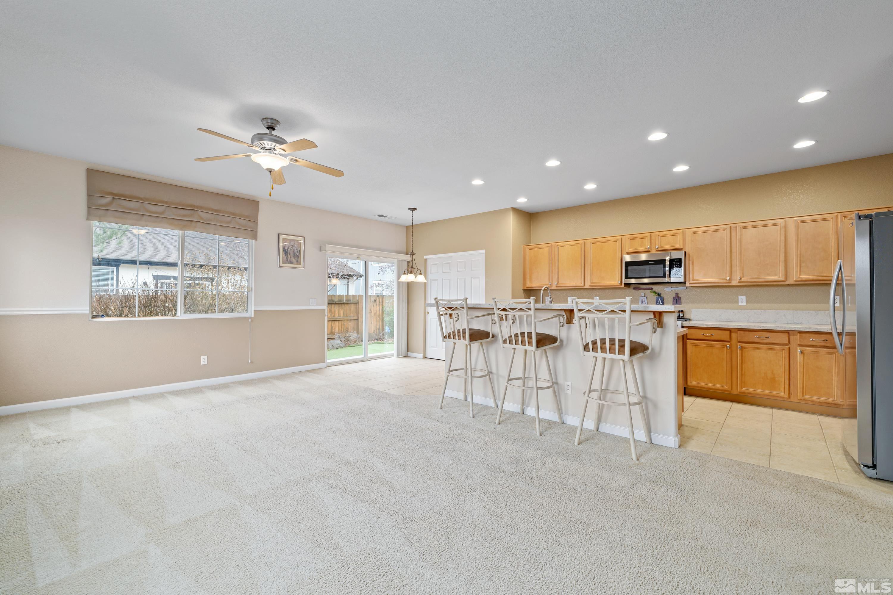 8900 Sorcha Street Reno, NV 89506 - Photo 12 of 39 a view of kitchen with furniture and window