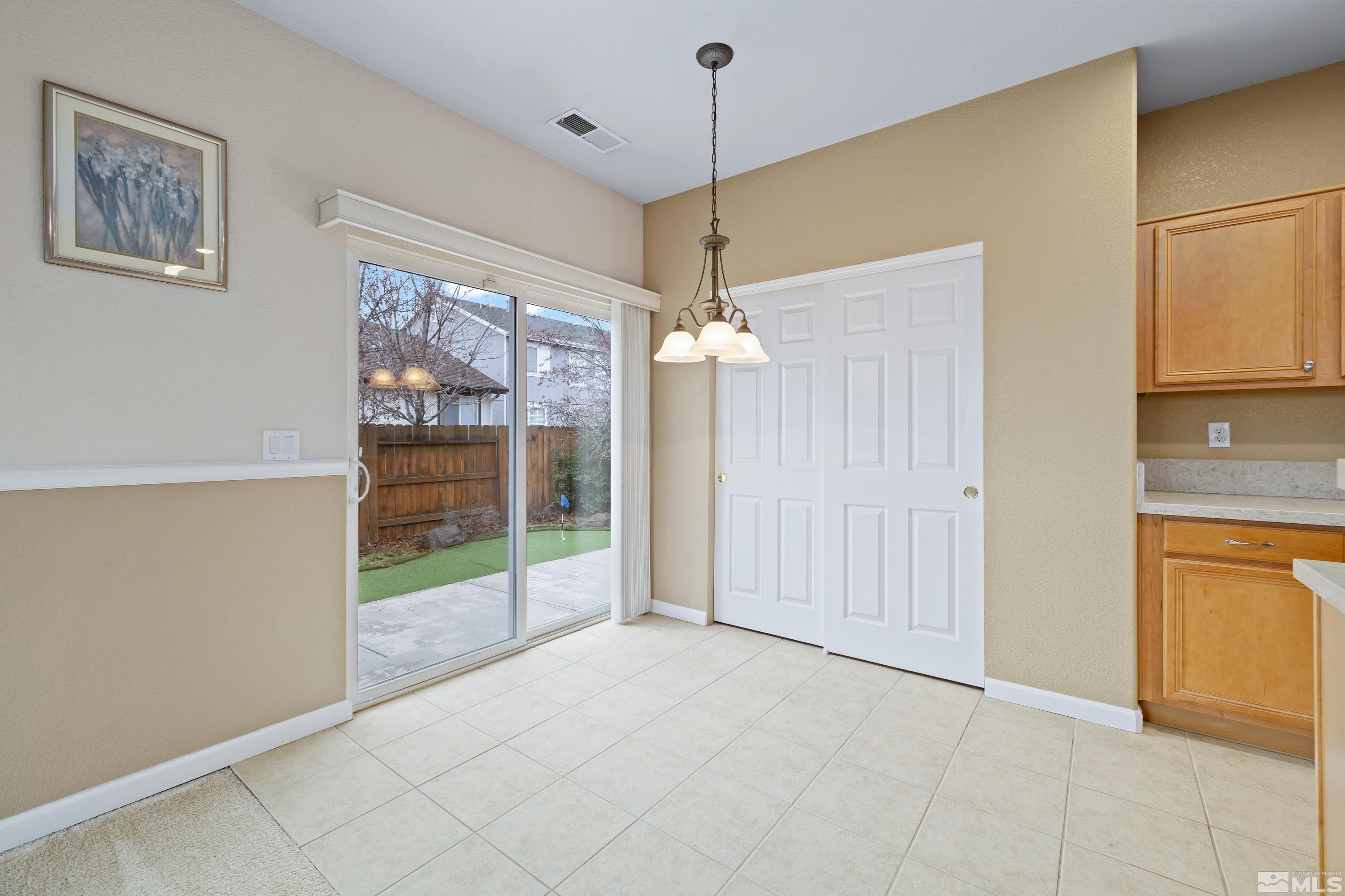 8900 Sorcha Street Reno, NV 89506 - Photo 13 of 39 a view of empty room with cabinet and fan