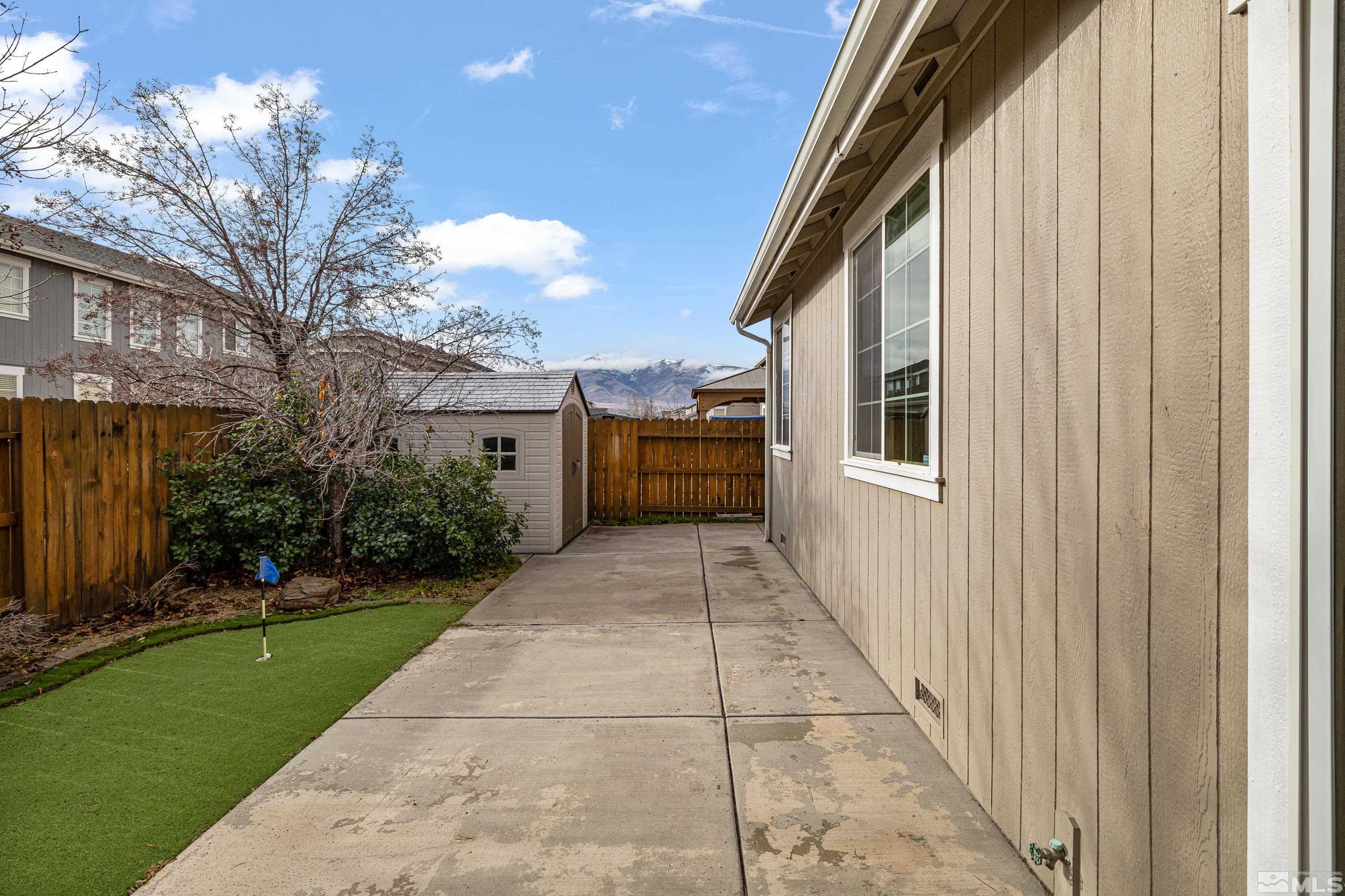 8900 Sorcha Street Reno, NV 89506 - Photo 16 of 39 a view of a house with a yard
