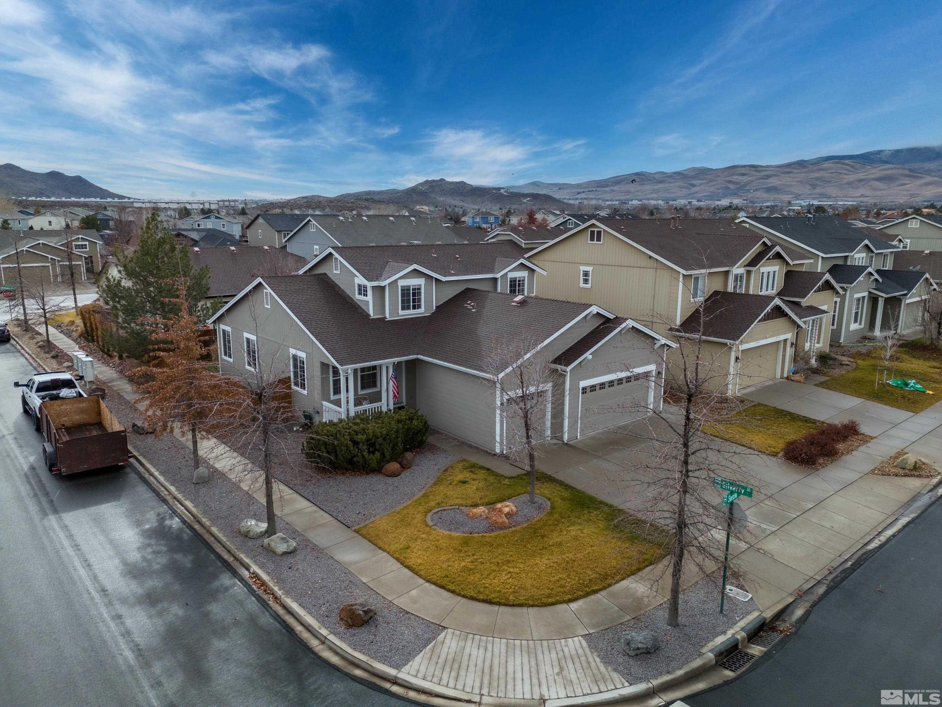8900 Sorcha Street Reno, NV 89506 - Photo 2 of 39 an aerial view of a house with swimming pool and mountain view