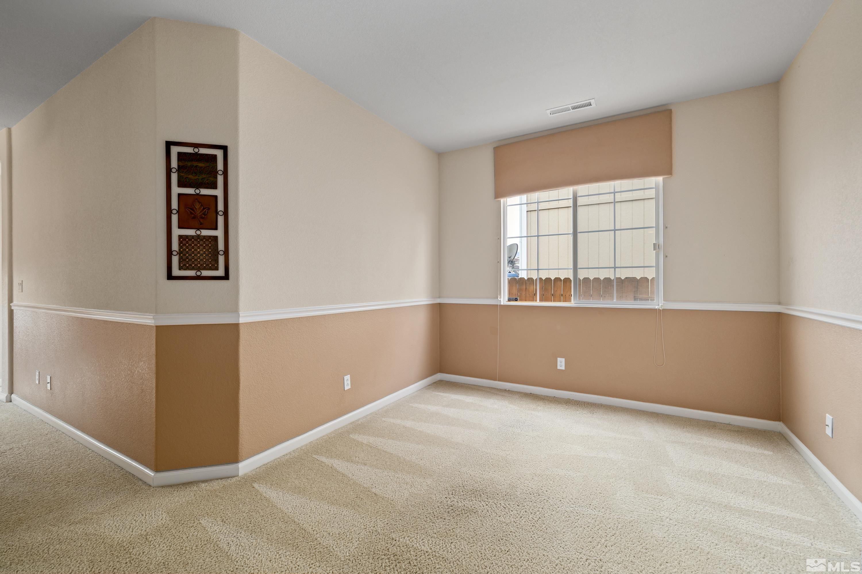 8900 Sorcha Street Reno, NV 89506 - Photo 21 of 39 an empty room with windows and closet