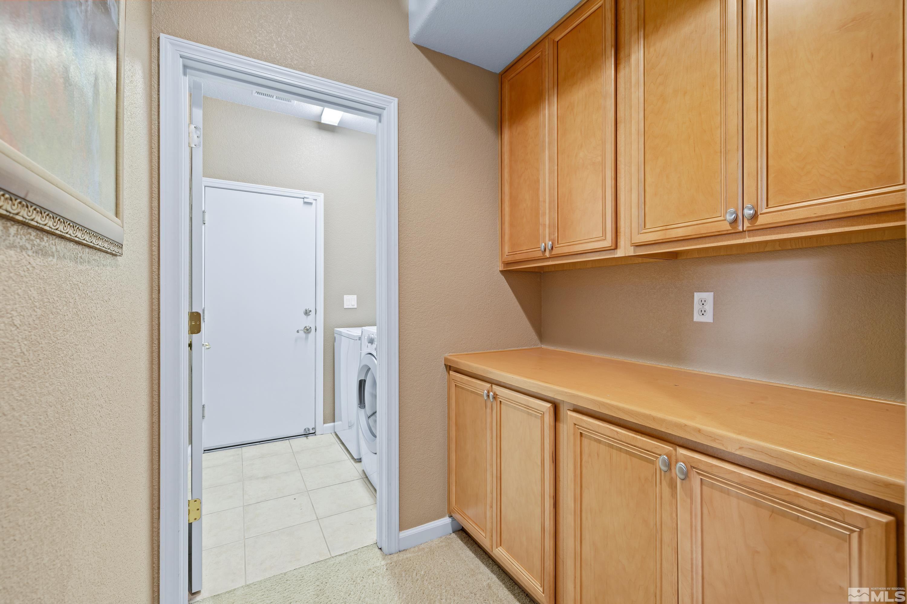 8900 Sorcha Street Reno, NV 89506 - Photo 23 of 39 a view of a kitchen with white cabinets