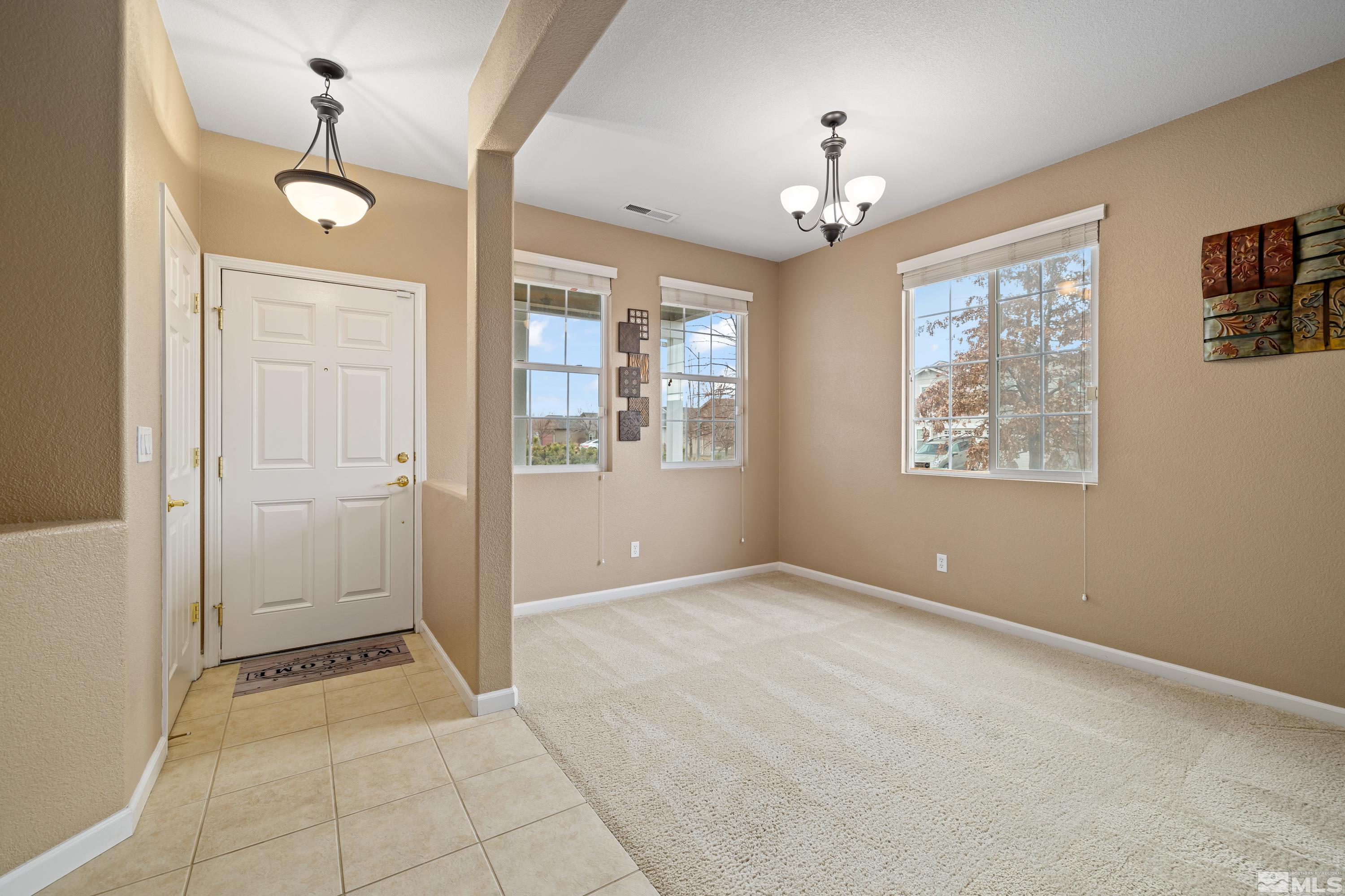 8900 Sorcha Street Reno, NV 89506 - Photo 26 of 39 wooden floor in an empty room with a window
