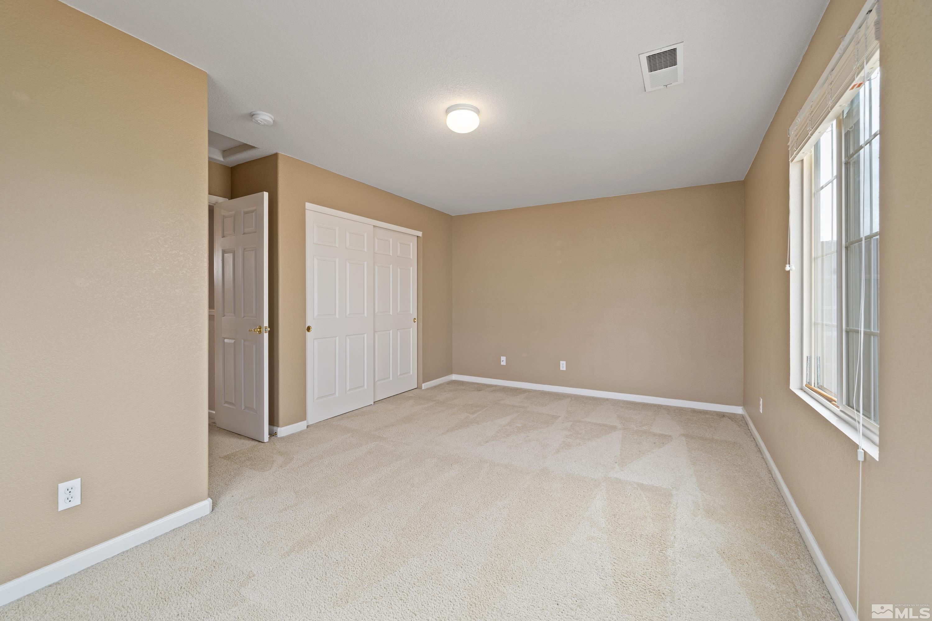 8900 Sorcha Street Reno, NV 89506 - Photo 29 of 39 an empty room with windows