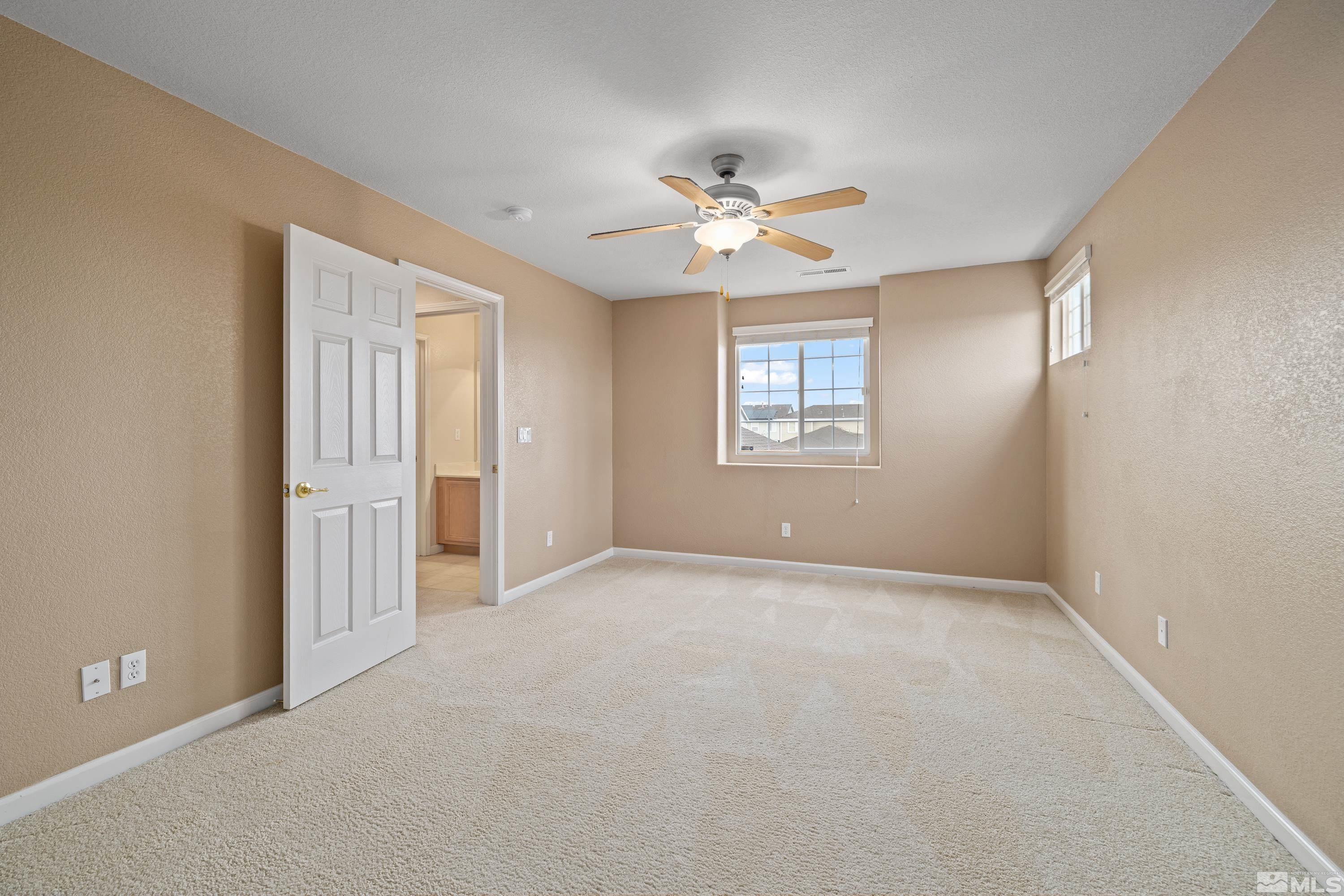 8900 Sorcha Street Reno, NV 89506 - Photo 30 of 39 a view of an empty room with a window