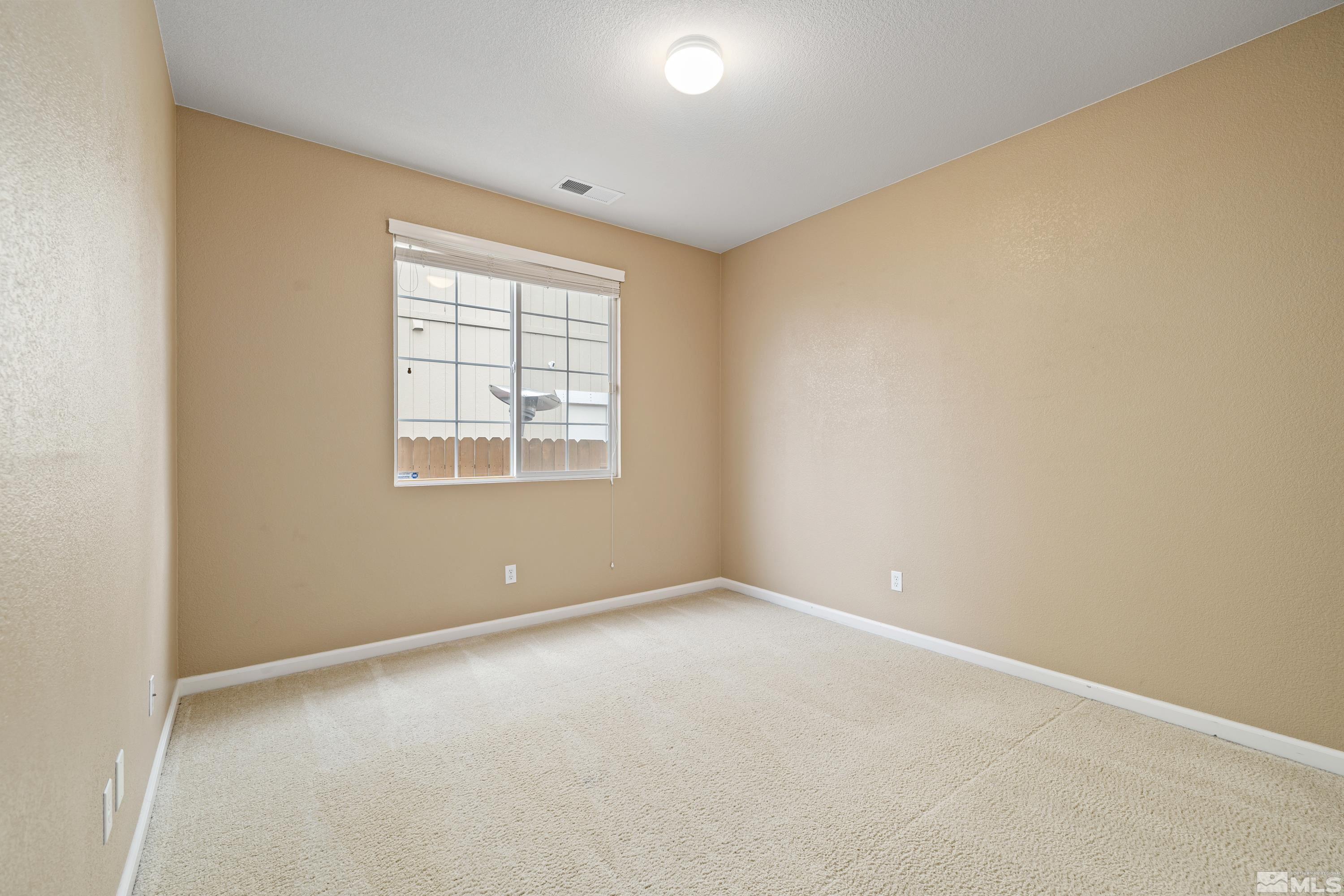 8900 Sorcha Street Reno, NV 89506 - Photo 34 of 39 an empty room with windows