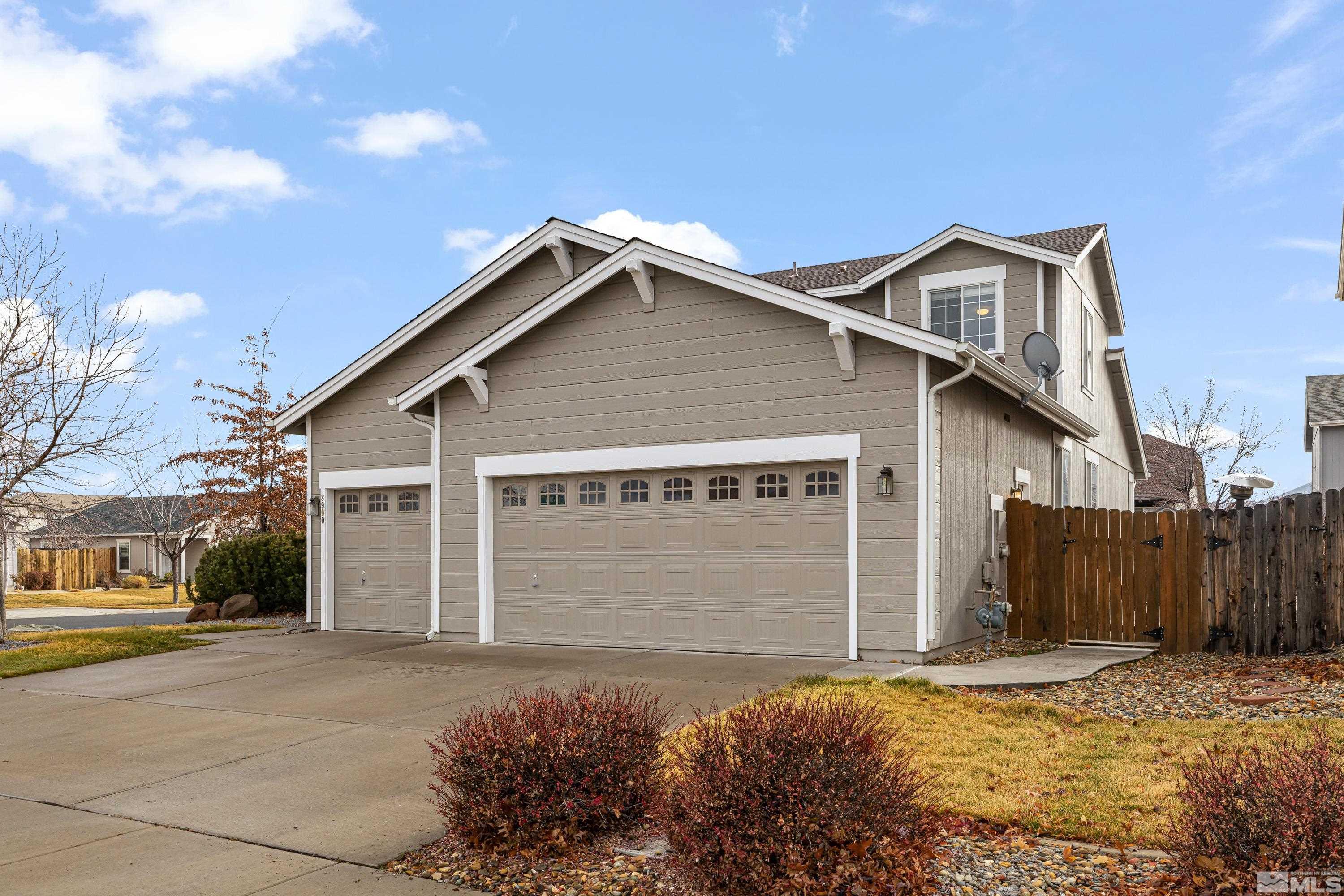 8900 Sorcha Street Reno, NV 89506 - Photo 39 of 39 a front view of a house with a yard and garage