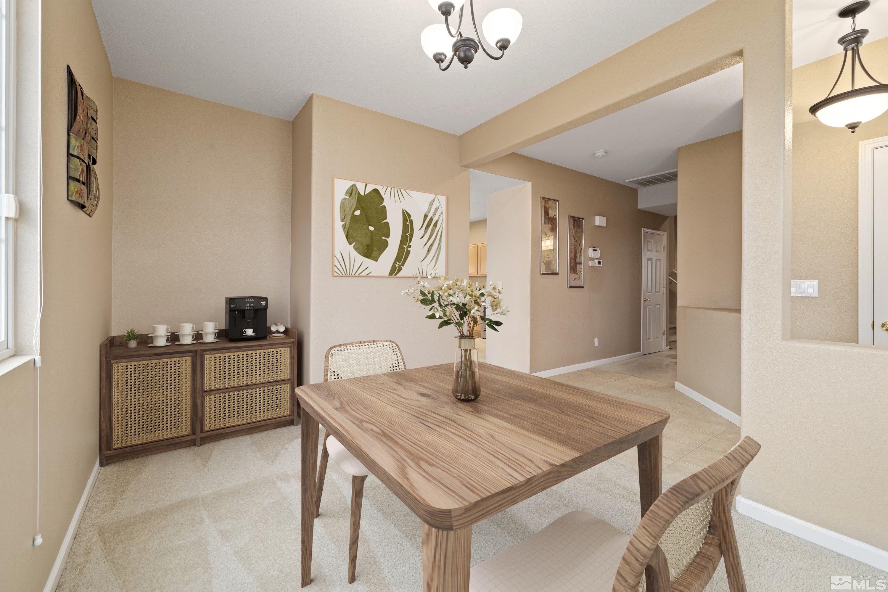 8900 Sorcha Street Reno, NV 89506 - Photo 4 of 39 a kitchen with a table and chairs in it