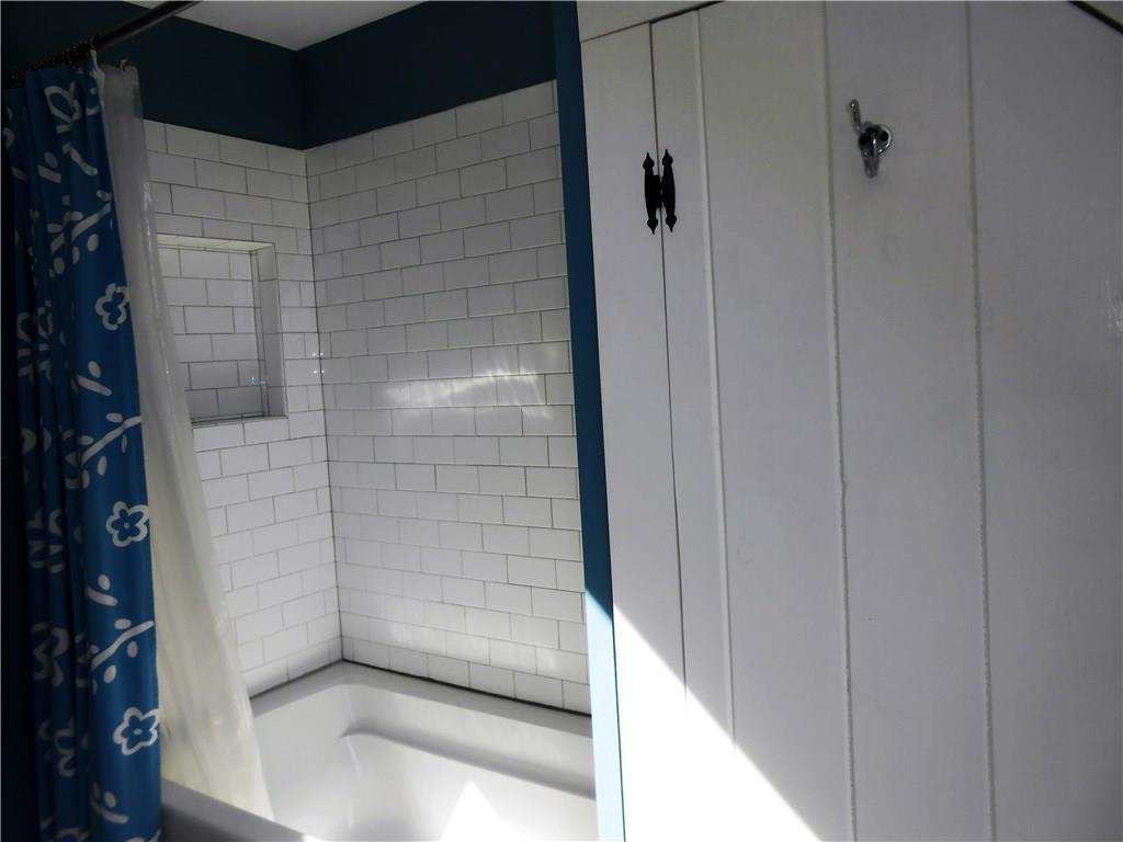 146 Southern Bay Road Penobscot, ME 04476 - Photo 15 of 19 Subway tile surrounds the tub.