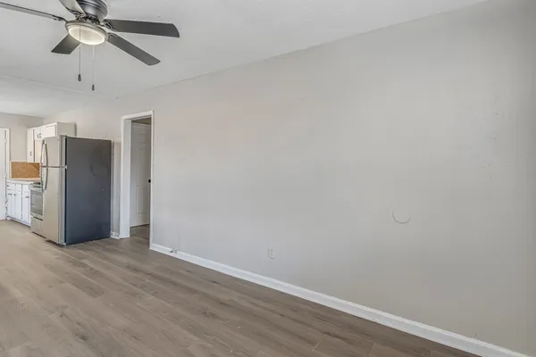 a view of an empty room with a window