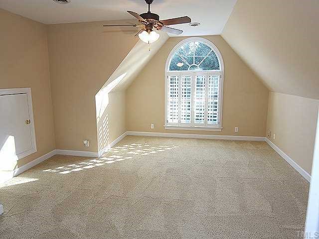 2936 Tillinghast Trail Raleigh, NC 27613 - Photo 8 of 12 a view of an empty room with a window