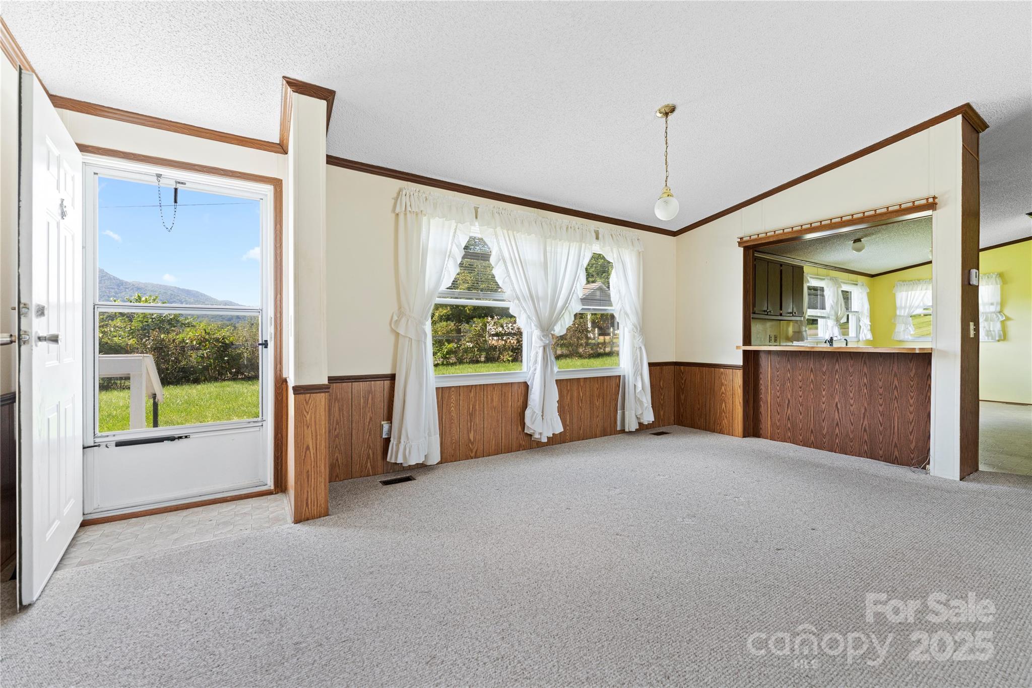 112 Melody Street Clyde, NC 28721 - Photo 11 of 47 a view of an empty room with a window