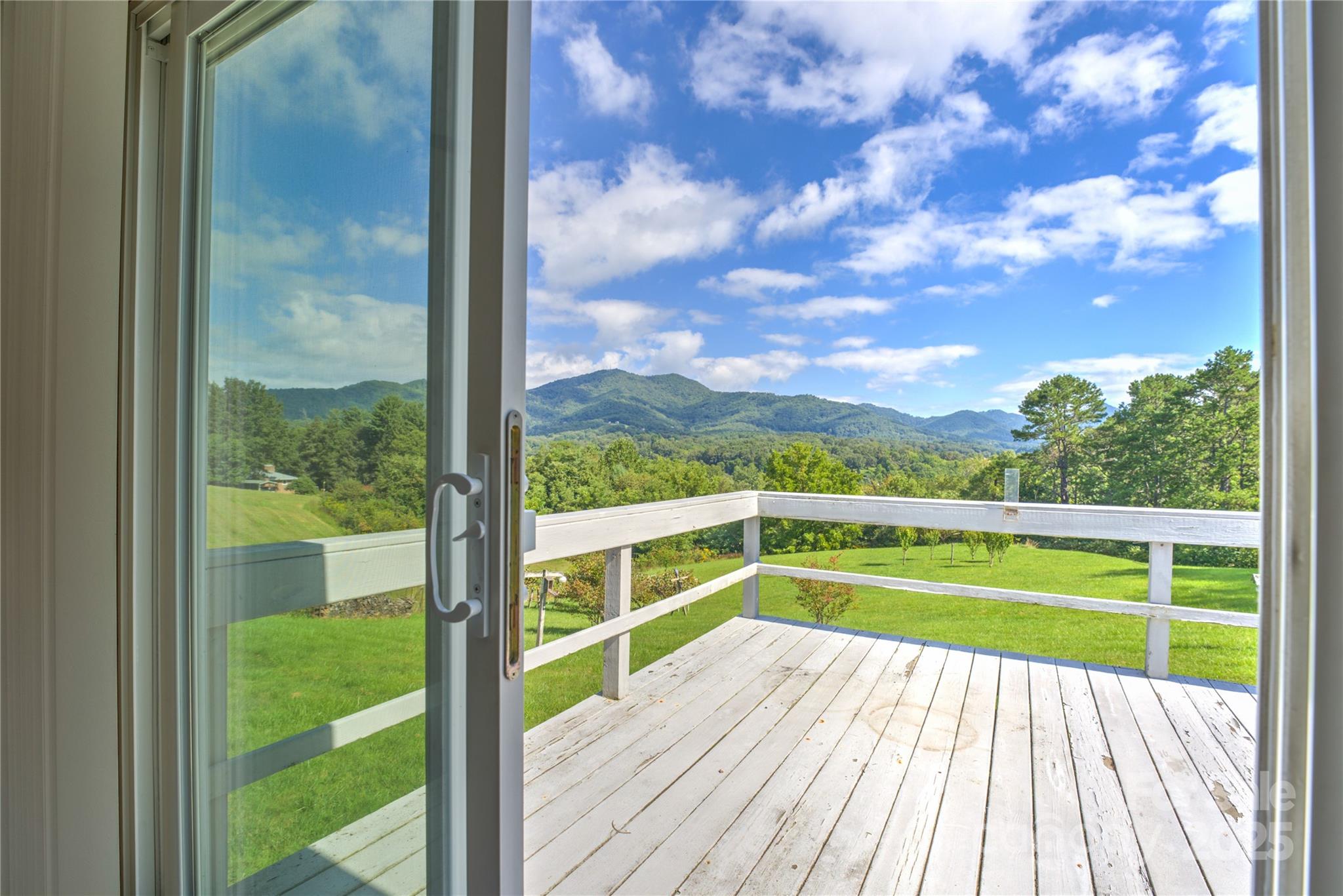 112 Melody Street Clyde, NC 28721 - Photo 12 of 47 a view of balcony with wooden floor and fence