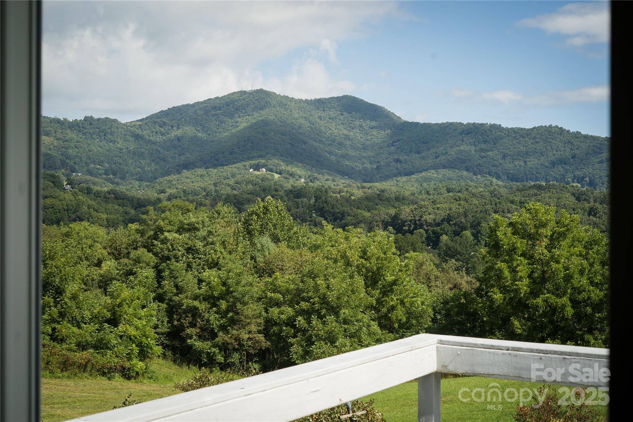 112 Melody Street Clyde, NC 28721 - Photo 15 of 47 a view of a mountain from a field
