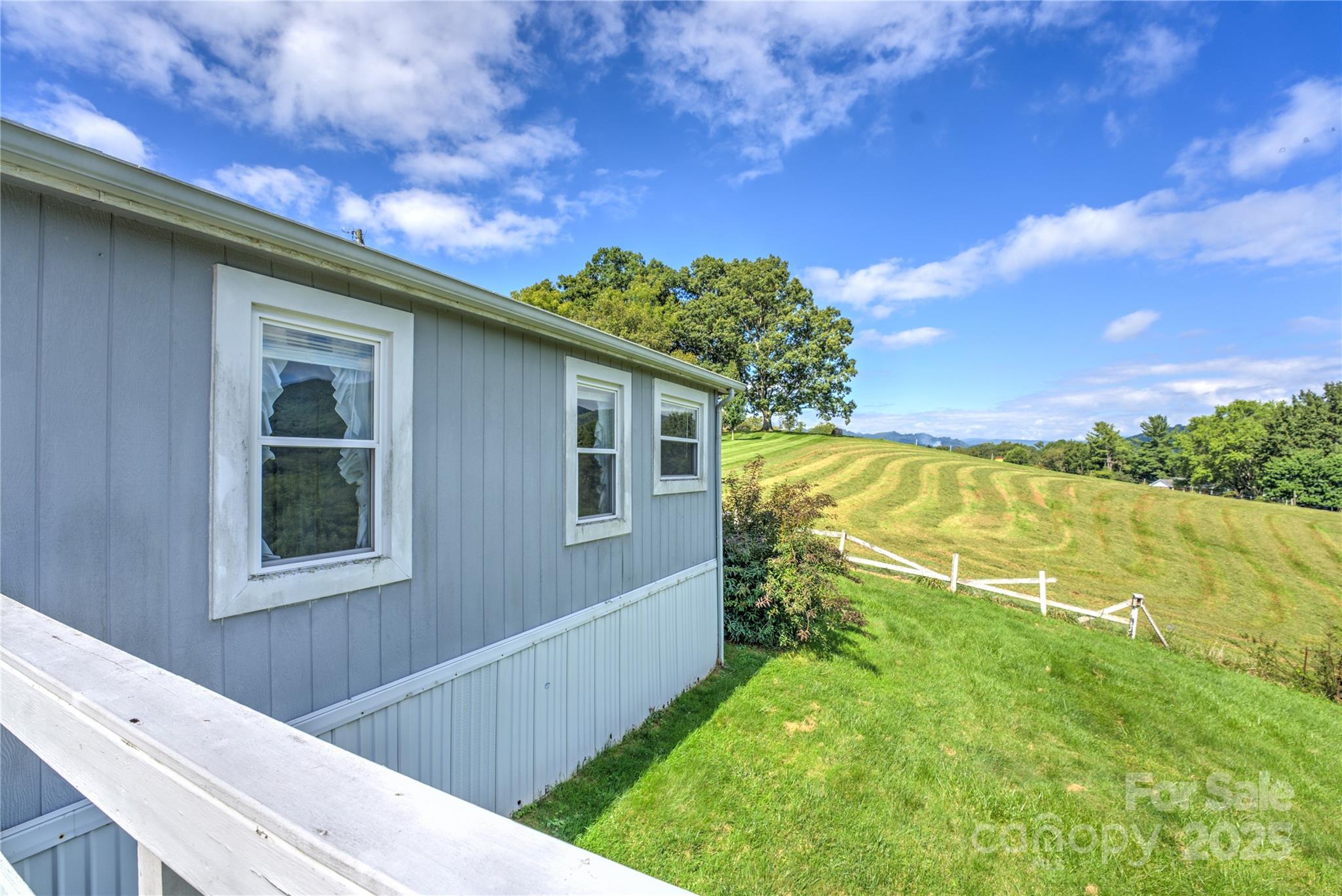 112 Melody Street Clyde, NC 28721 - Photo 16 of 47 a view of a backyard