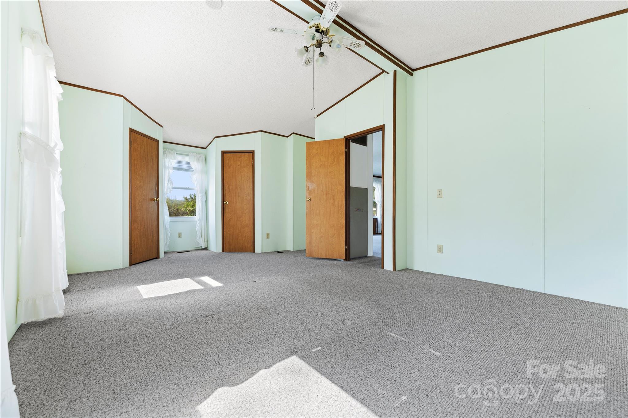 112 Melody Street Clyde, NC 28721 - Photo 25 of 47 a view of a big room with wooden floor and cabinet