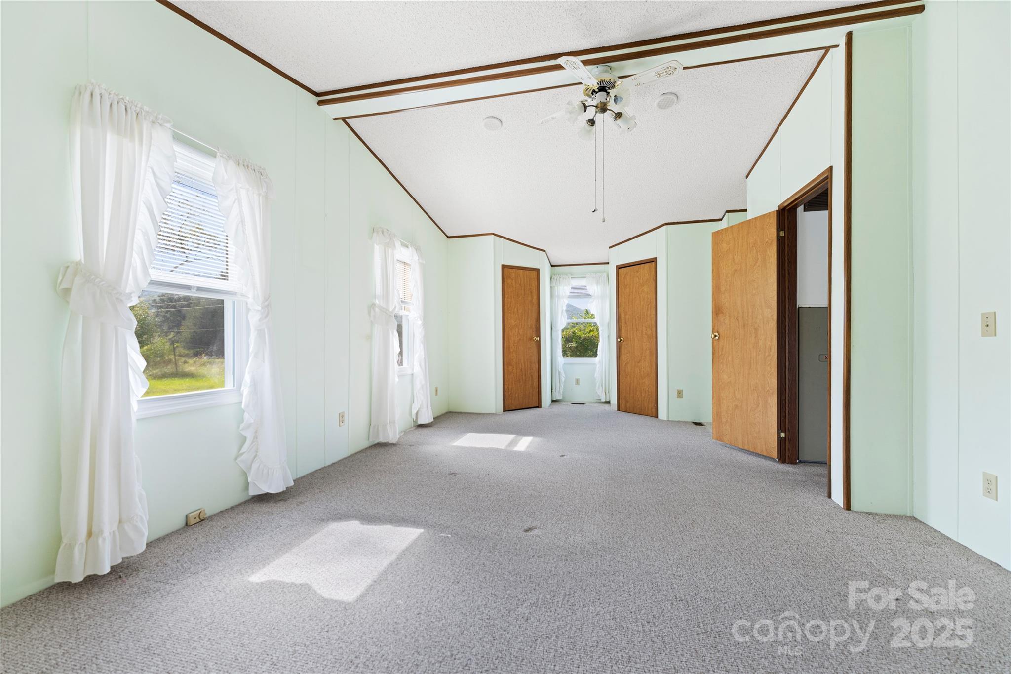 112 Melody Street Clyde, NC 28721 - Photo 26 of 47 a view of an empty room with a window
