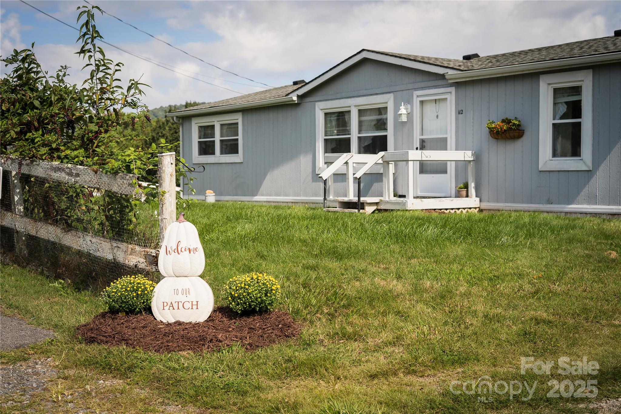 112 Melody Street Clyde, NC 28721 - Photo 46 of 47 a front view of house with yard