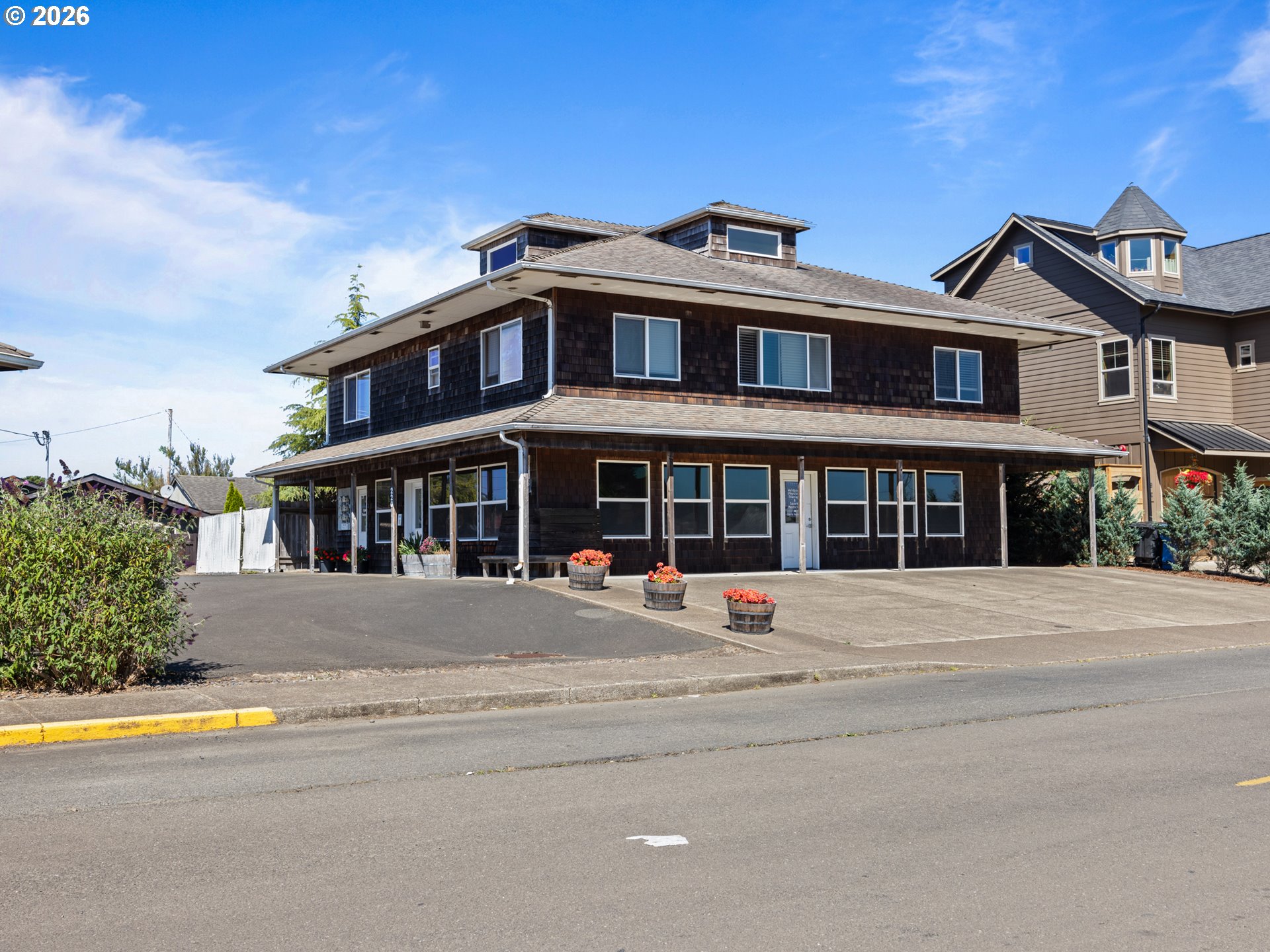 220 Northwest Spring Street Waldport, OR 97394 - Photo 1 of 16 a view of multiple houses with a street