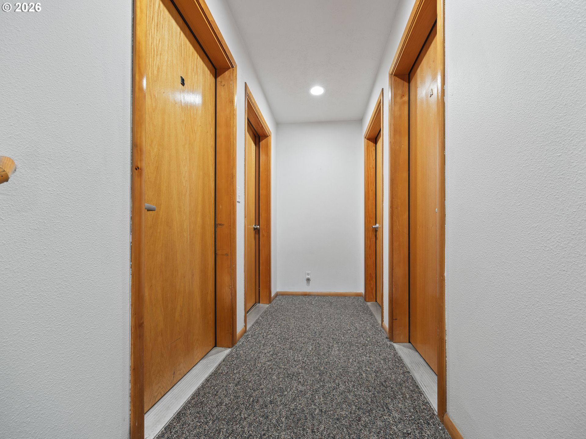 220 Northwest Spring Street Waldport, OR 97394 - Photo 11 of 16 a view of hallway with wooden floor