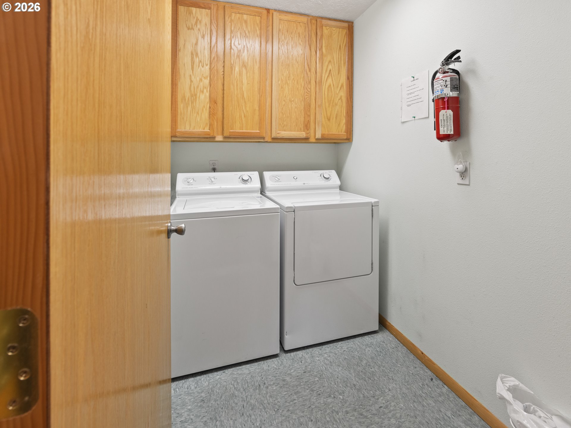 220 Northwest Spring Street Waldport, OR 97394 - Photo 12 of 16 a utility room with dryer and washer