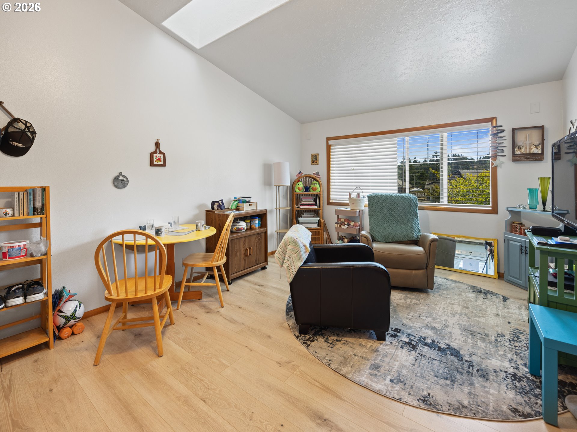 220 Northwest Spring Street Waldport, OR 97394 - Photo 14 of 16 a living room with furniture and a large window