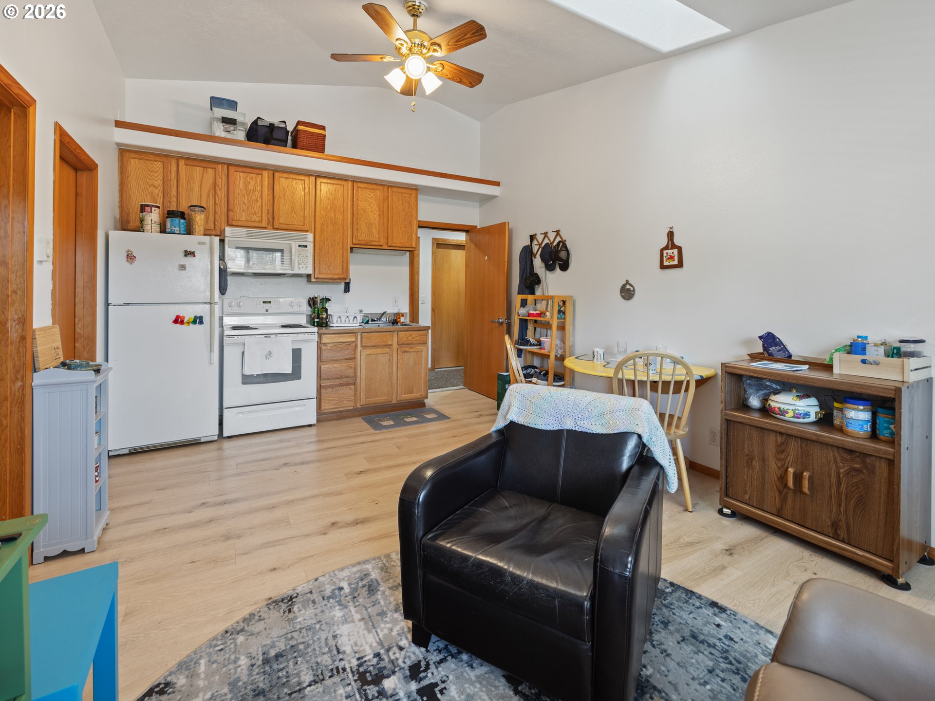 220 Northwest Spring Street Waldport, OR 97394 - Photo 15 of 16 a bedroom with furniture and a wooden floor