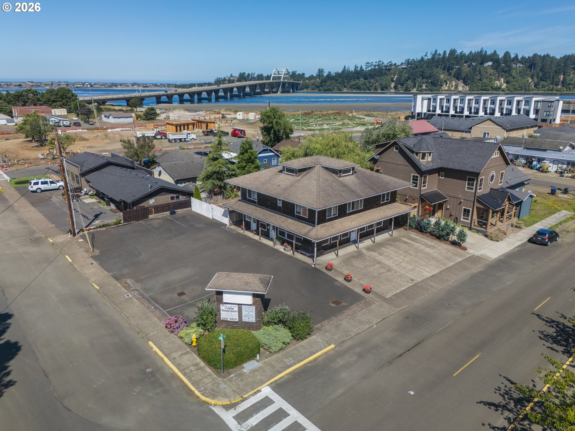 220 Northwest Spring Street Waldport, OR 97394 - Photo 4 of 16 an aerial view of a house with a lake view