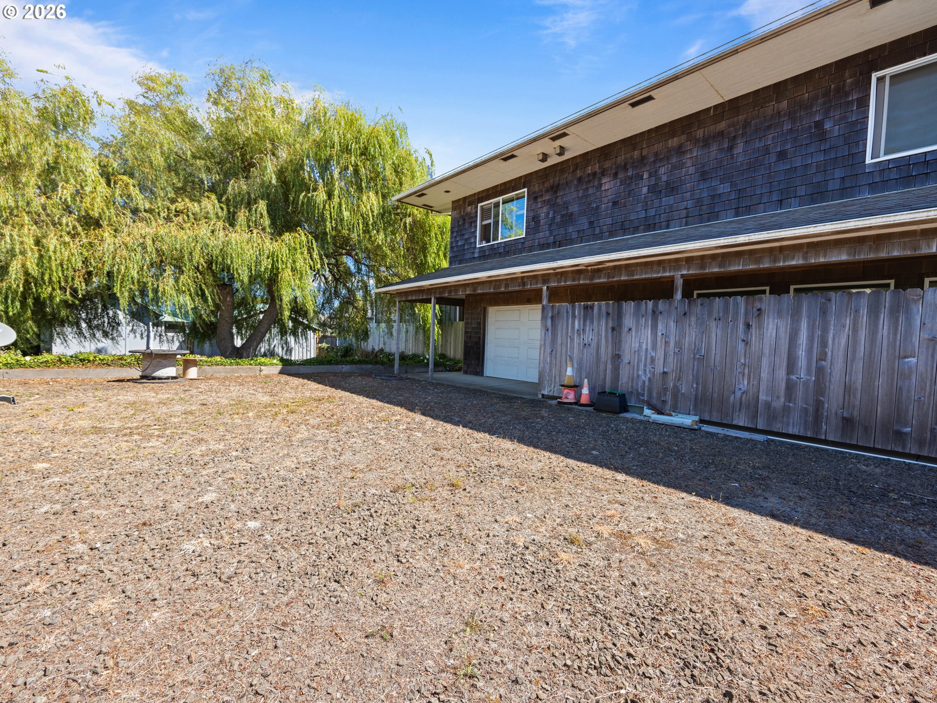 220 Northwest Spring Street Waldport, OR 97394 - Photo 8 of 16 a front view of a house with a yard