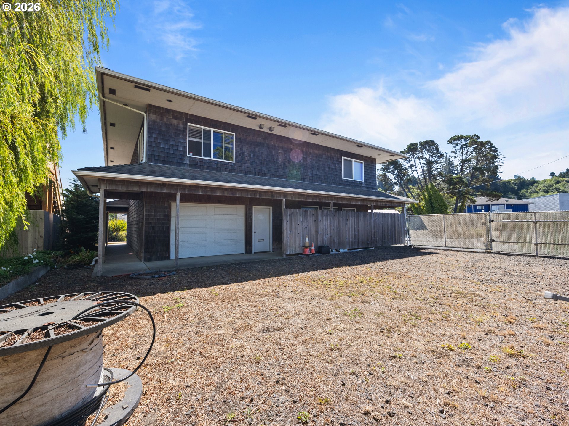 220 Northwest Spring Street Waldport, OR 97394 - Photo 9 of 16 a house view with a backyard space