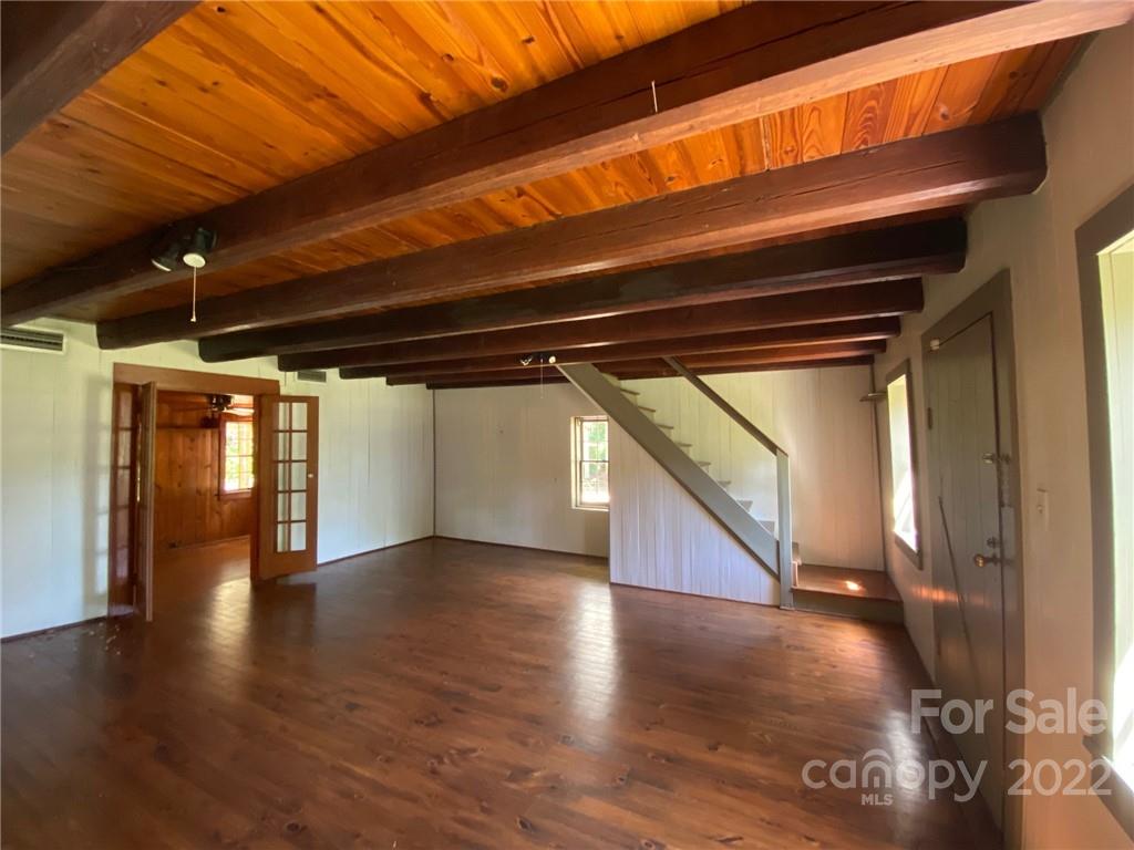 9425 Robinson Church Road Charlotte, NC 28215 - Photo 19 of 34 a view of an empty room with wooden floor