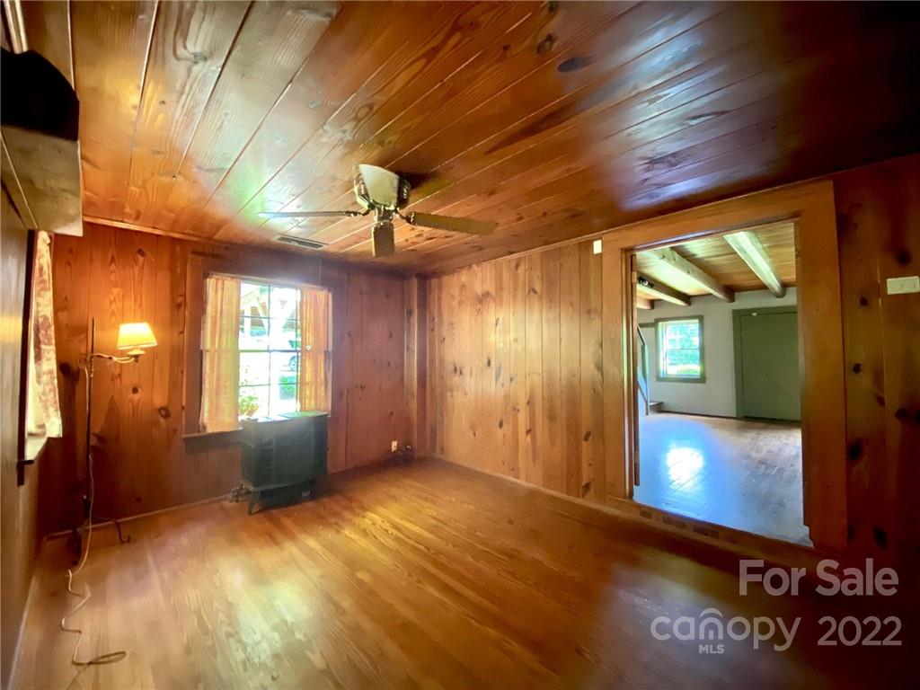 9425 Robinson Church Road Charlotte, NC 28215 - Photo 24 of 34 a view of an empty room with window and wooden floor