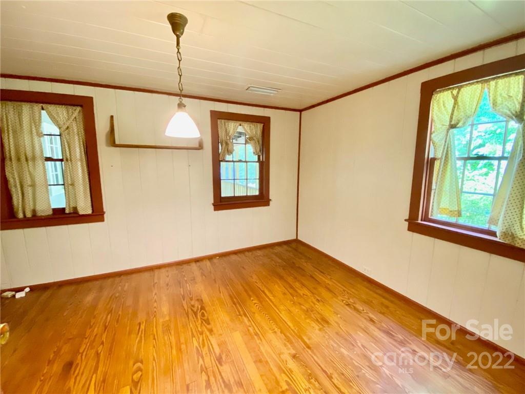 9425 Robinson Church Road Charlotte, NC 28215 - Photo 25 of 34 a view of an empty room with a window and wooden floor
