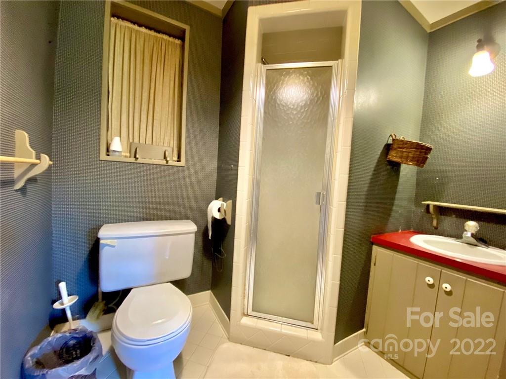 9425 Robinson Church Road Charlotte, NC 28215 - Photo 26 of 34 a bathroom with a toilet and a sink