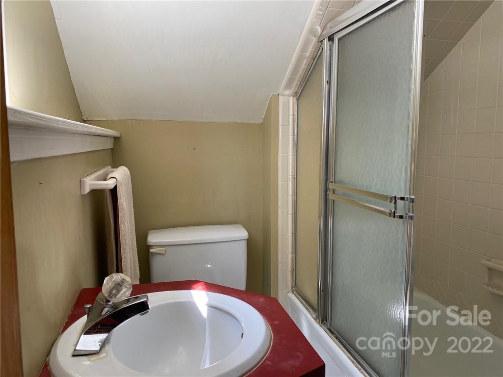 9425 Robinson Church Road Charlotte, NC 28215 - Photo 29 of 34 a bathroom with a sink and a toilet