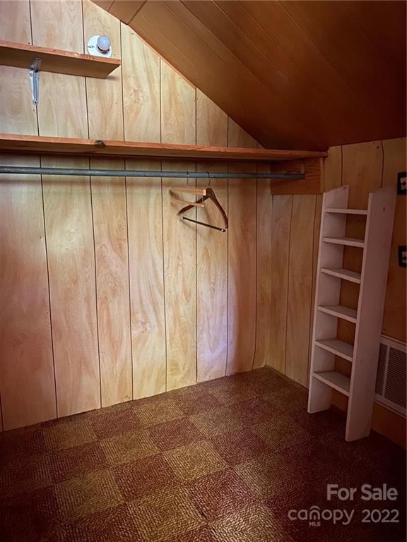 9425 Robinson Church Road Charlotte, NC 28215 - Photo 31 of 34 a view of walk in closet with empty racks