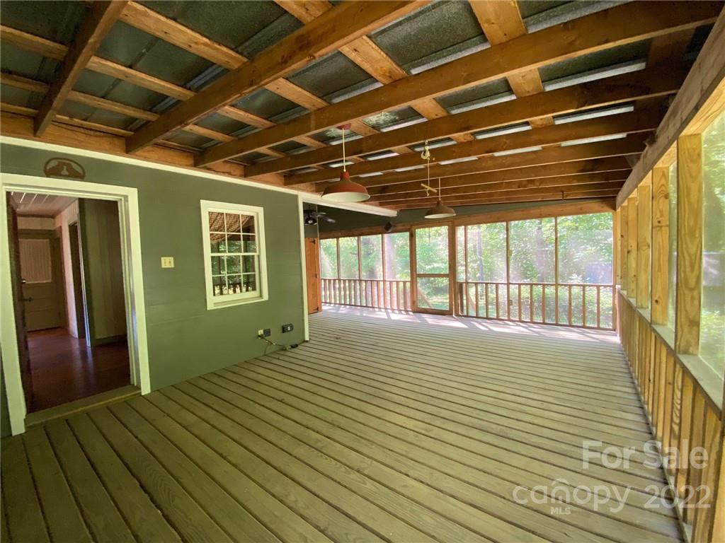 9425 Robinson Church Road Charlotte, NC 28215 - Photo 33 of 34 a view of an empty room with wooden floor and a window