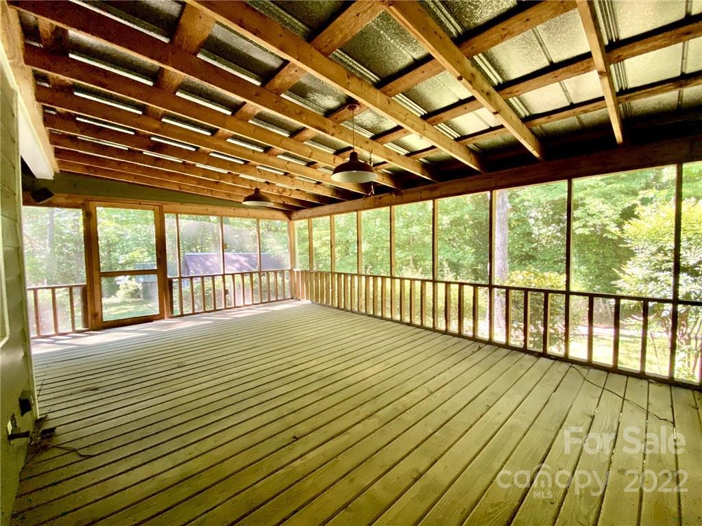 9425 Robinson Church Road Charlotte, NC 28215 - Photo 34 of 34 a view of an empty room with wooden floor and a window