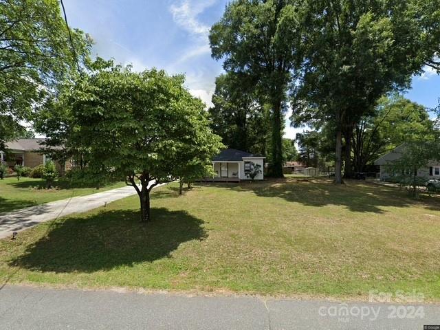 855 Sunderland Road Southwest Concord, NC 28027 - Photo 1 of 1 a swimming pool with outdoor seating and yard