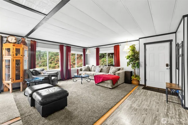 a large dining space with furniture window and outside view