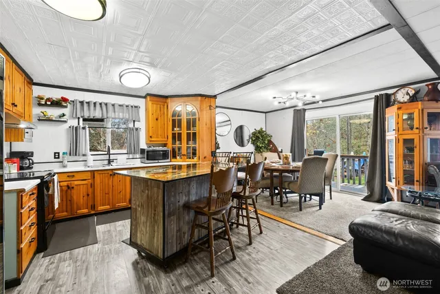 a view of a dining room with furniture window and outside view