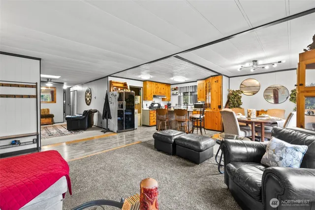 a dining room with furniture window and wooden floor