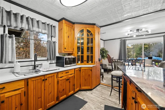 a kitchen with counter and chairs